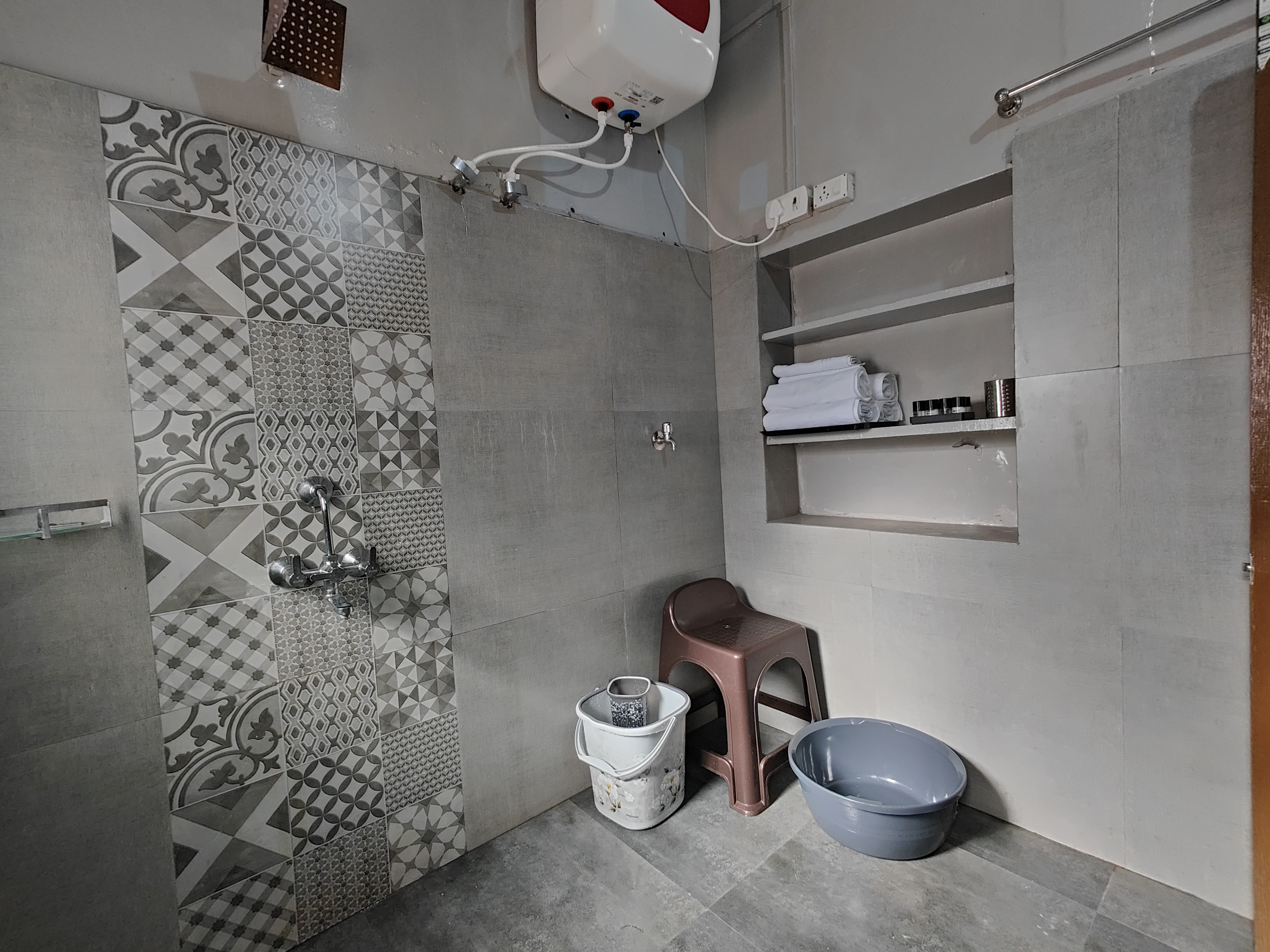 Clean attached bathroom with hot water in the villa