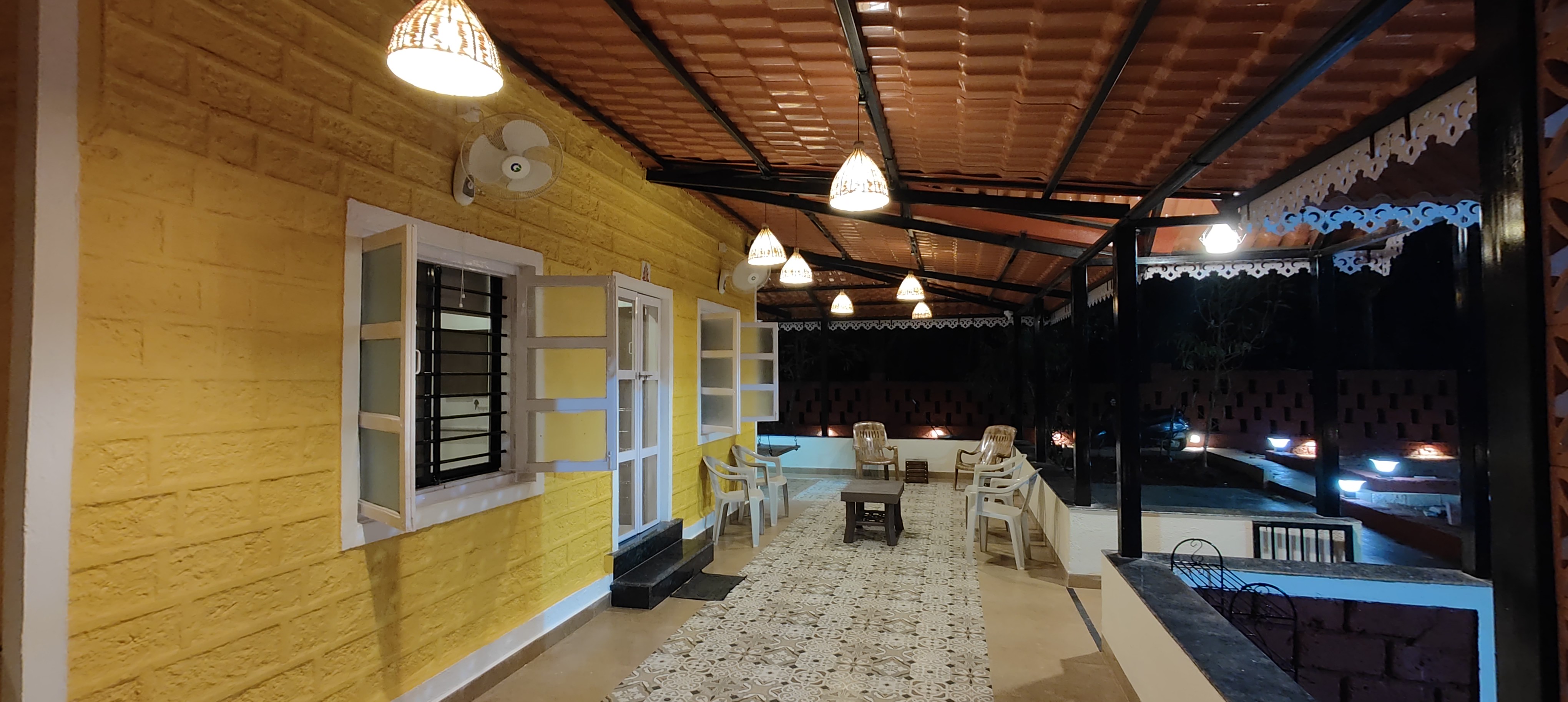 Warmly lit verandah in the evening at the villa in Dapoli