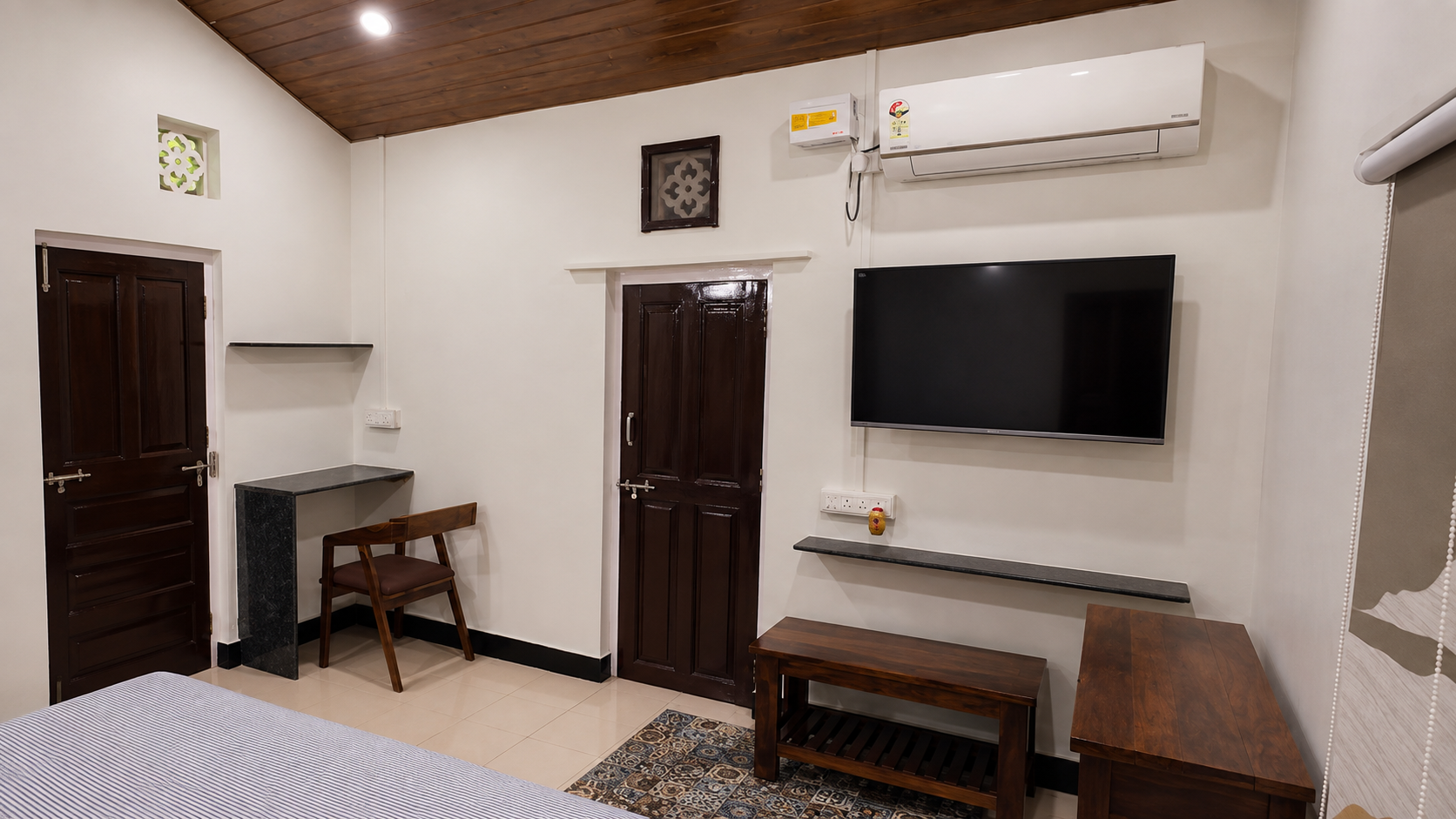 bedroom upstairs with AC, TV and attached terrace 